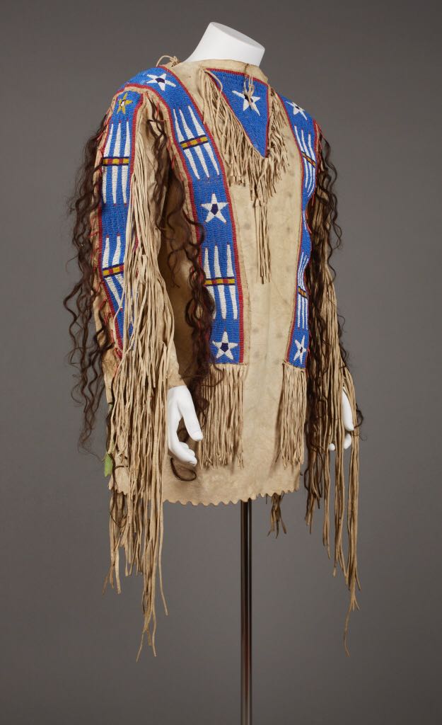 Traditional Native American headdress with blue and red patterns on a gray background