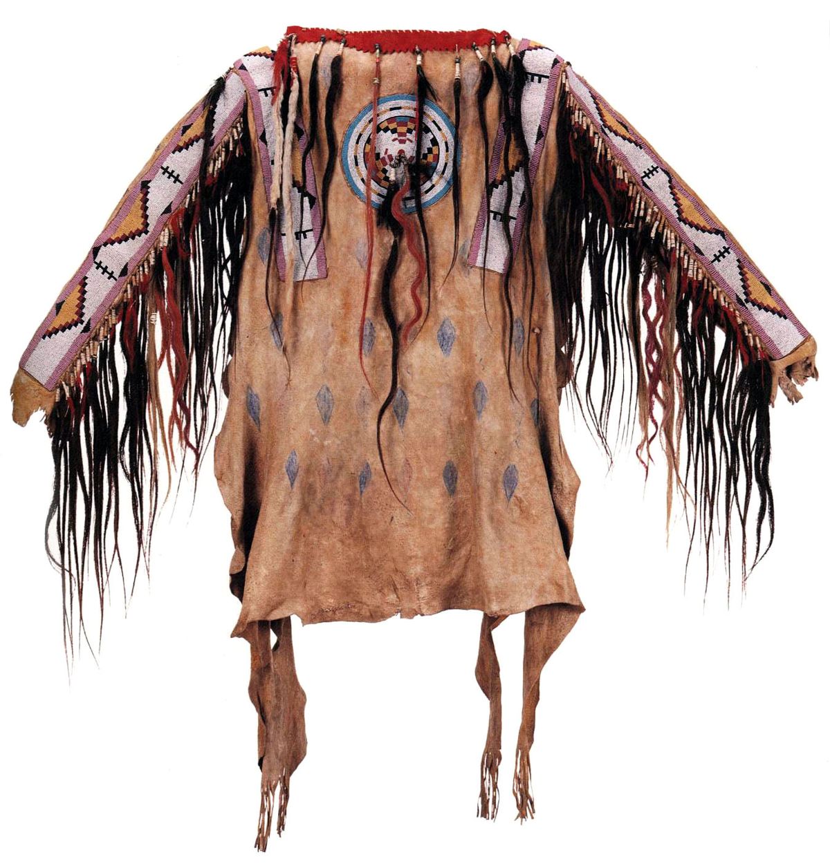 Traditional Native American garment with intricate patterns and fringes on a white background