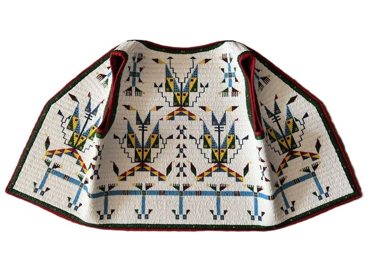 Traditional patterned garment on a white background