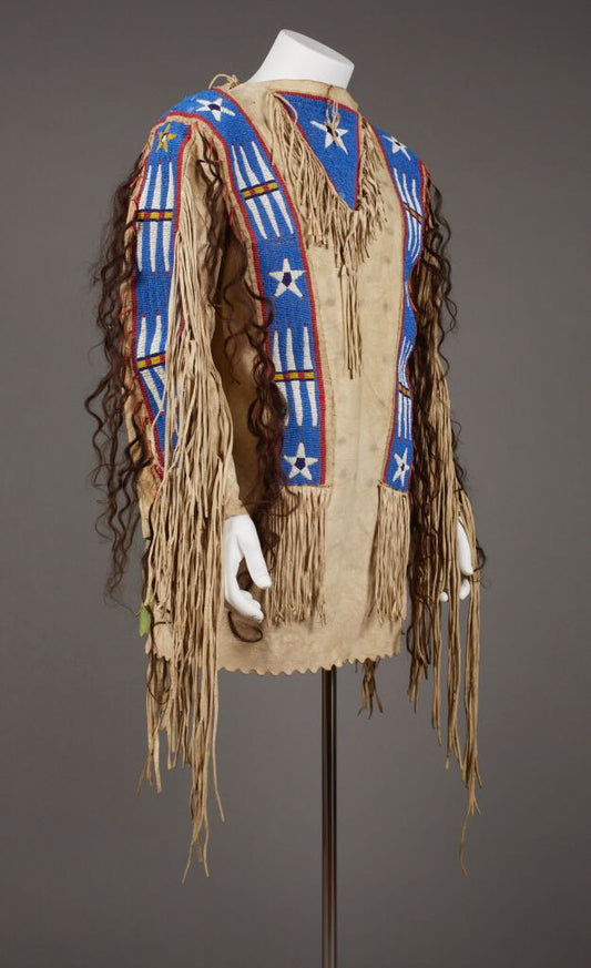 Traditional Native American headdress with blue and red patterns on a gray background