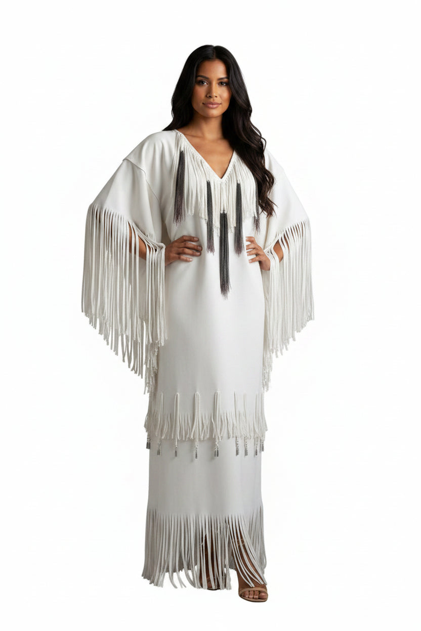 native Woman wearing a white dress with fringe details on a white background