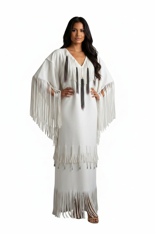native Woman wearing a white dress with fringe details on a white background