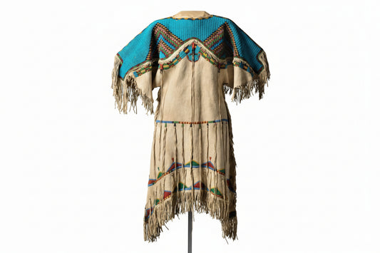 Traditional Native American wedding dress with fringes and colorful beadwork 